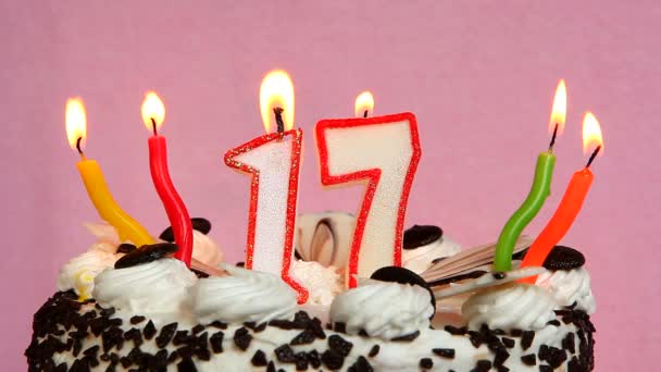 Happy 17 birthday with cake and candles on pink background — Stock Video