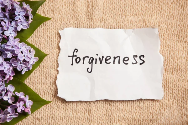 Forgiveness word on beautiful background with flowers — Stock Photo, Image