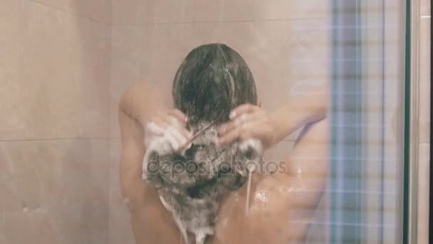 Shower girl wash her hair and head in slowmotion — Stock Video