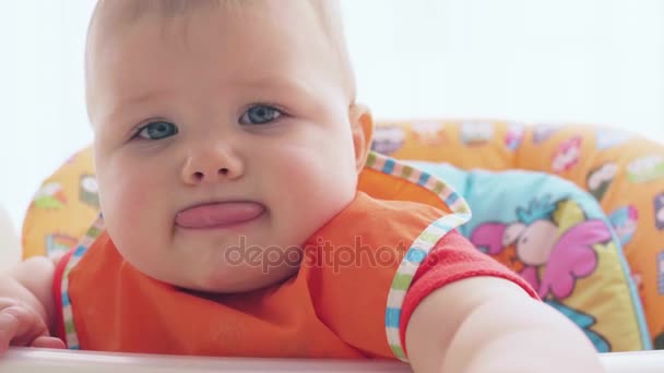 A hungry child requires food and greedily eats from a spoon — Stock Video