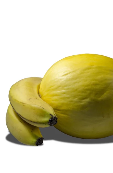 Heerlijke sappige gele meloen en bananen — Stockfoto
