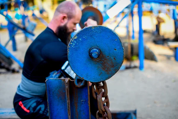 Man during workout in outdoor gym — Stock Photo