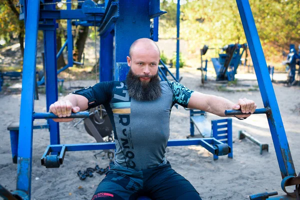 Active man doing exercises for chest — Stock Photo