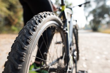 Close up view of bicycle with man clipart