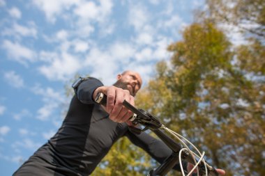 Bearded cyclist riding bicycle clipart