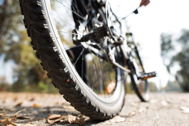 Rear view of man with bicycle clipart