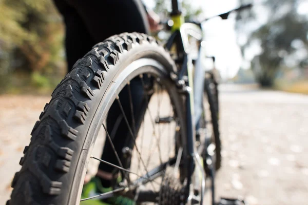 Close up view of bicycle with man — Stock Photo, Image