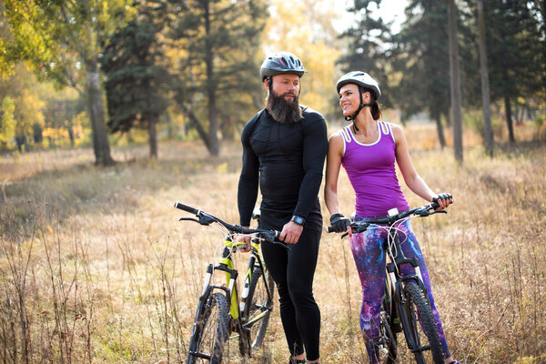 Couple cycling outdoors