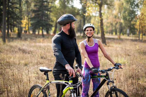 Couple cycling outdoors