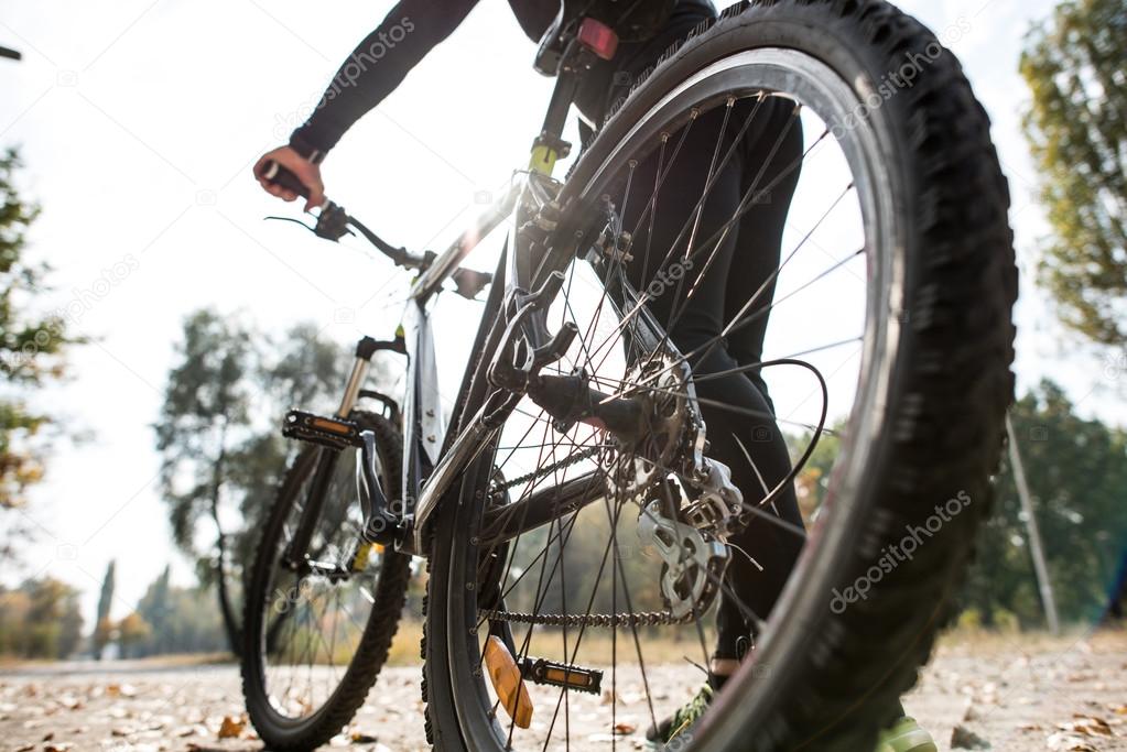 Rear view of man with bicycle