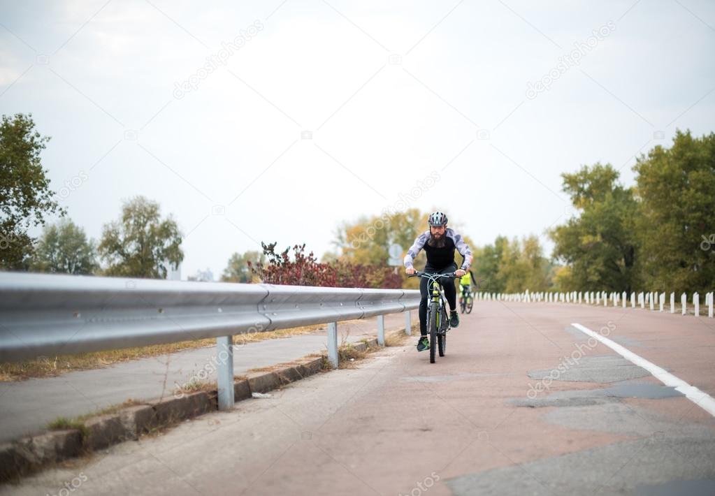 Man cycling on road 