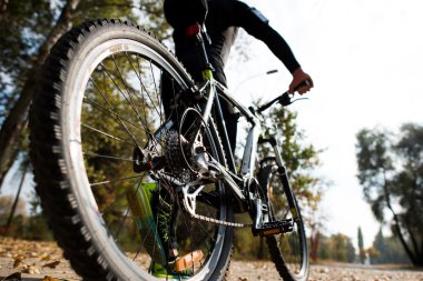 Man in sportswear with bicycle clipart