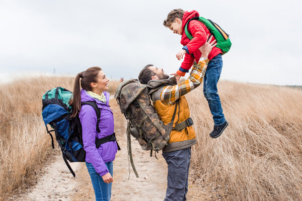 Happy father holding little son 
