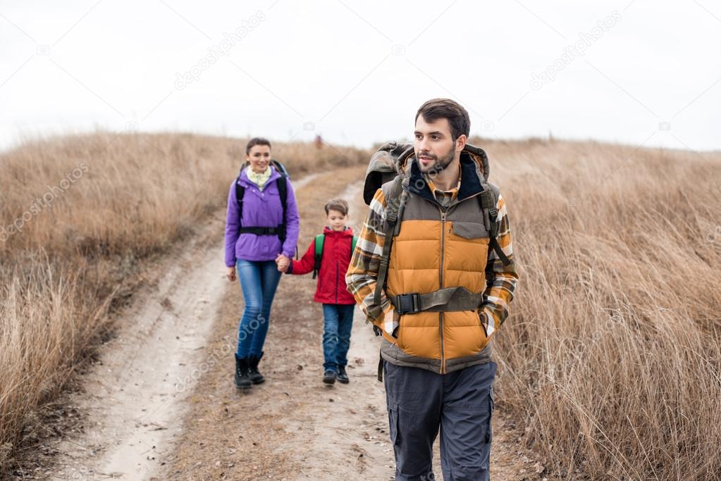 Man with wife and son backpacking