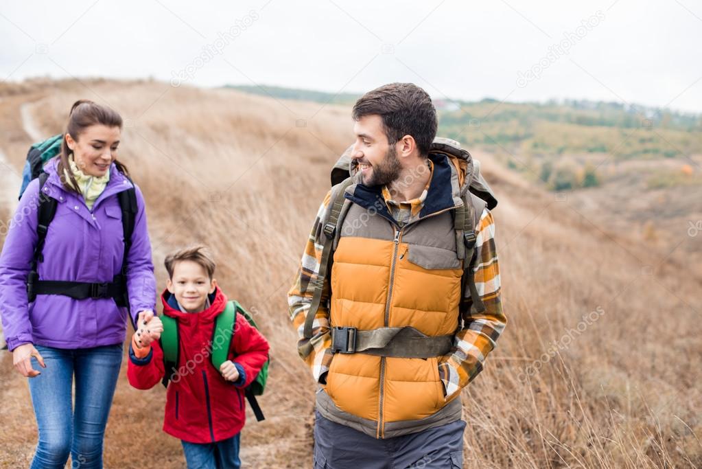 Man with wife and son backpacking
