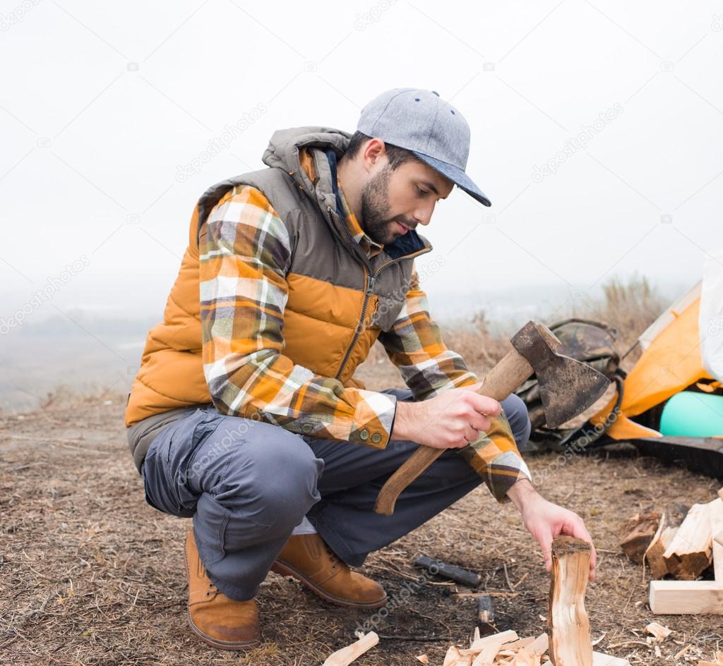 Man chopping firewood with axe