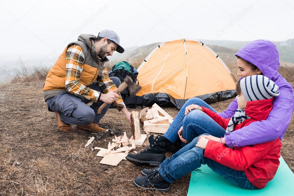 Man chopping firewood with axe