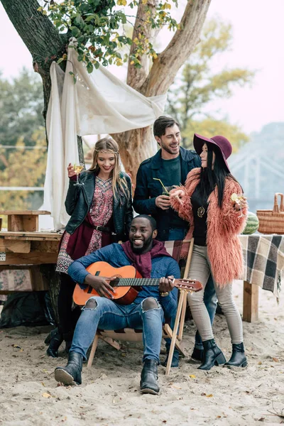 Happy young people at picnic — Stock Photo, Image