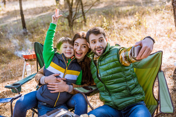 Happy family taking selfie