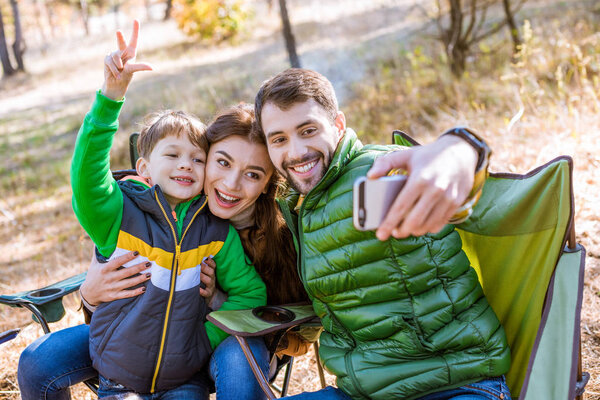 Happy family taking selfie