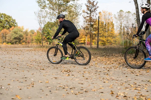 Bearded man cycling in park — Stock Photo