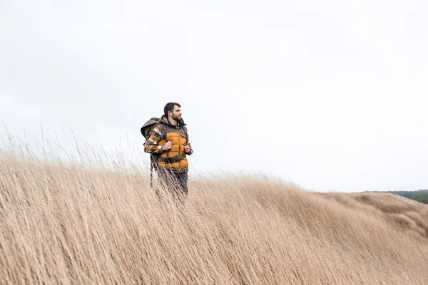 Young bearded man with backpack — Stock Photo