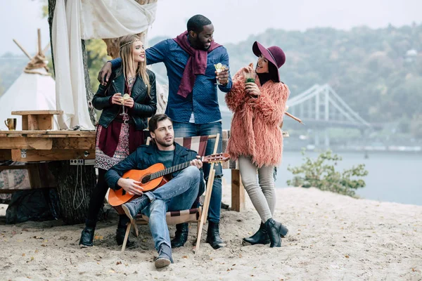 Happy young people at picnic — Stock Photo