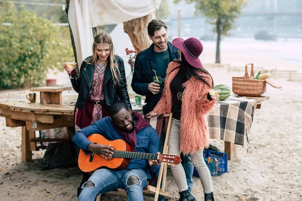 Happy young people at picnic — Stock Photo