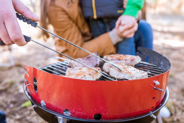 Grilling meat on charcoal grill — Stock Photo