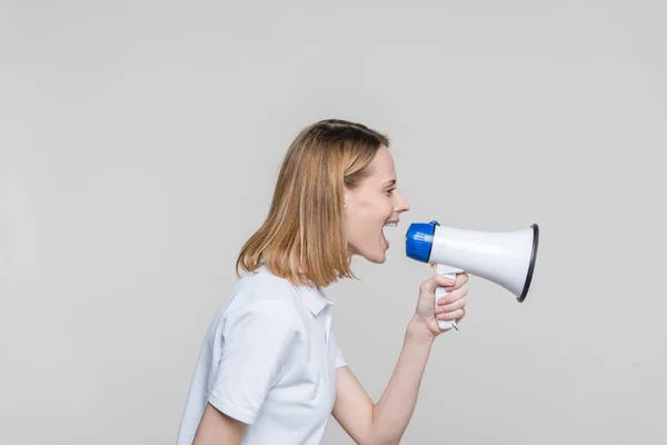 Woman screaming into megaphone — Stock Photo