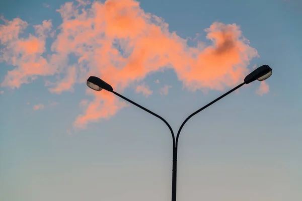 Street light and red cloud