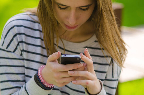 Young woman using her phone