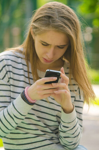 Young woman using her phone