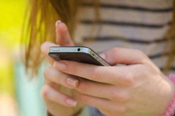 Young woman using her phone