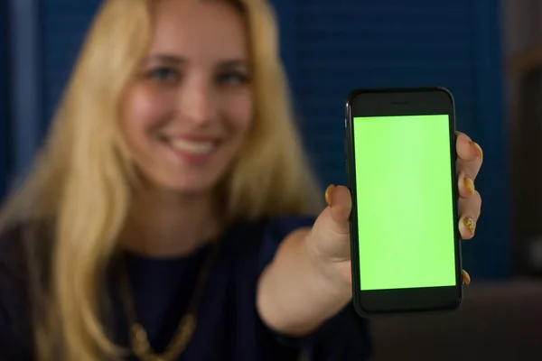cellphone screen in young womans hands