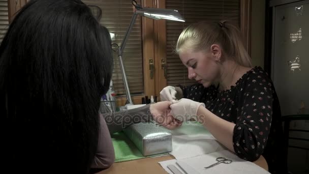 Manicure master cafefully working with the nails — Stock Video