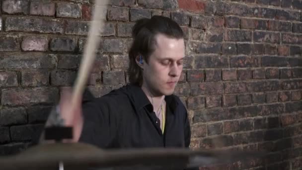 Young man playing the drums in the garage closeup — Stock Video