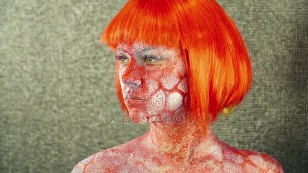 Young woman with body art in a bright wig — Stock Video