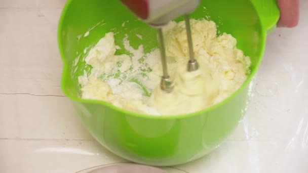 Womans hands mixing butter with the flour closeup — Stock Video