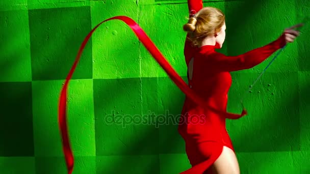 Young woman dancing with the ribbon closeup — Stock Video