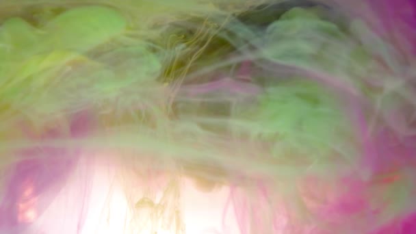 Ink of green, pink and white color pouring into water abstract background texture — Stock Video