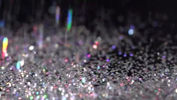 White glitter falling on the black background, abstract slow motion — Stock Video