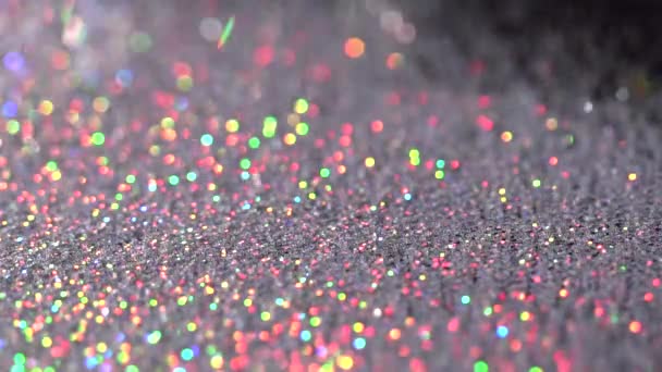 White chaminic sparkles falling on the black background, abstract slow motion — Stock Video