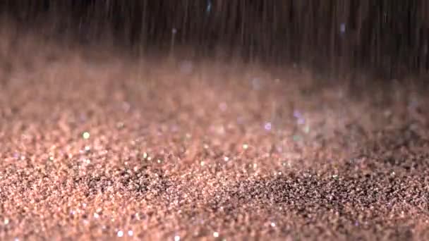 Cream glitter falling on the black background, abstract slow motion — Stock Video