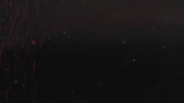 Siyah arka plan üzerine, soyut yavaş uçan Altın Portakal ışıltı