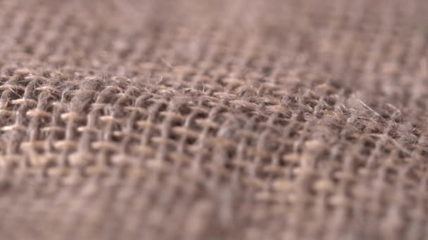 Primer plano de una textura de saco cámara lenta, macro — Vídeo de stock