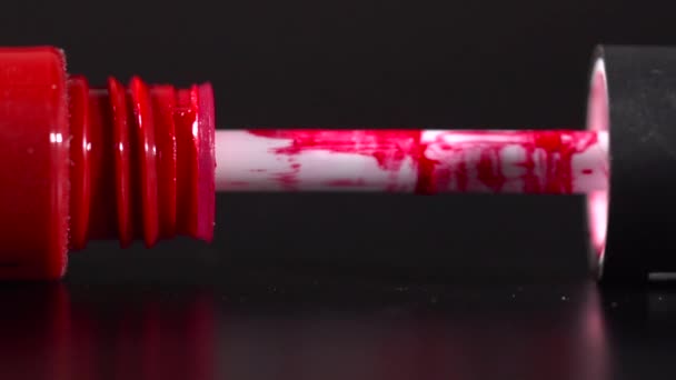 Closeup of opening a red liquid lipstick slow motion — Stock Video