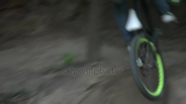 Dirt riding on bike in the forest slow motion closeup — Stock Video