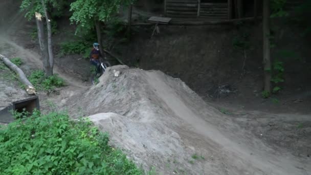 Dirt riding on bike in the forest during the summer slow motion — Stock Video