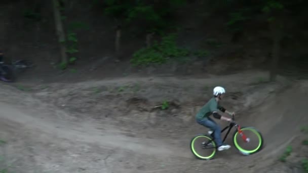 Dirt riding on bike on hills in the forest slow motion — Stock Video